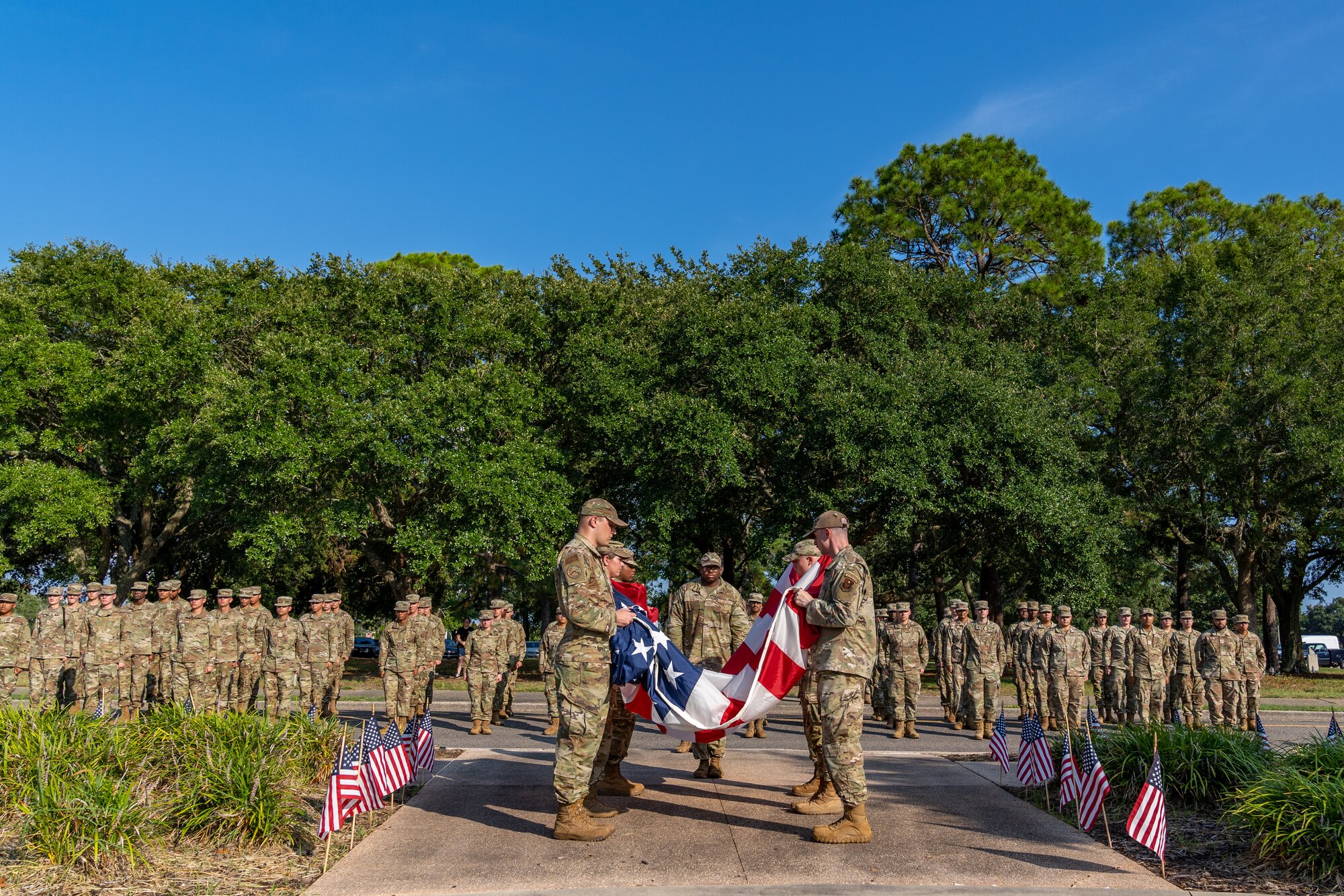 81st Training Wing Airmen fold the national colors during the POW/MIA Retreat Ceremony at Keesler Air Force Base, Mississippi, Sept. 15, 2023.