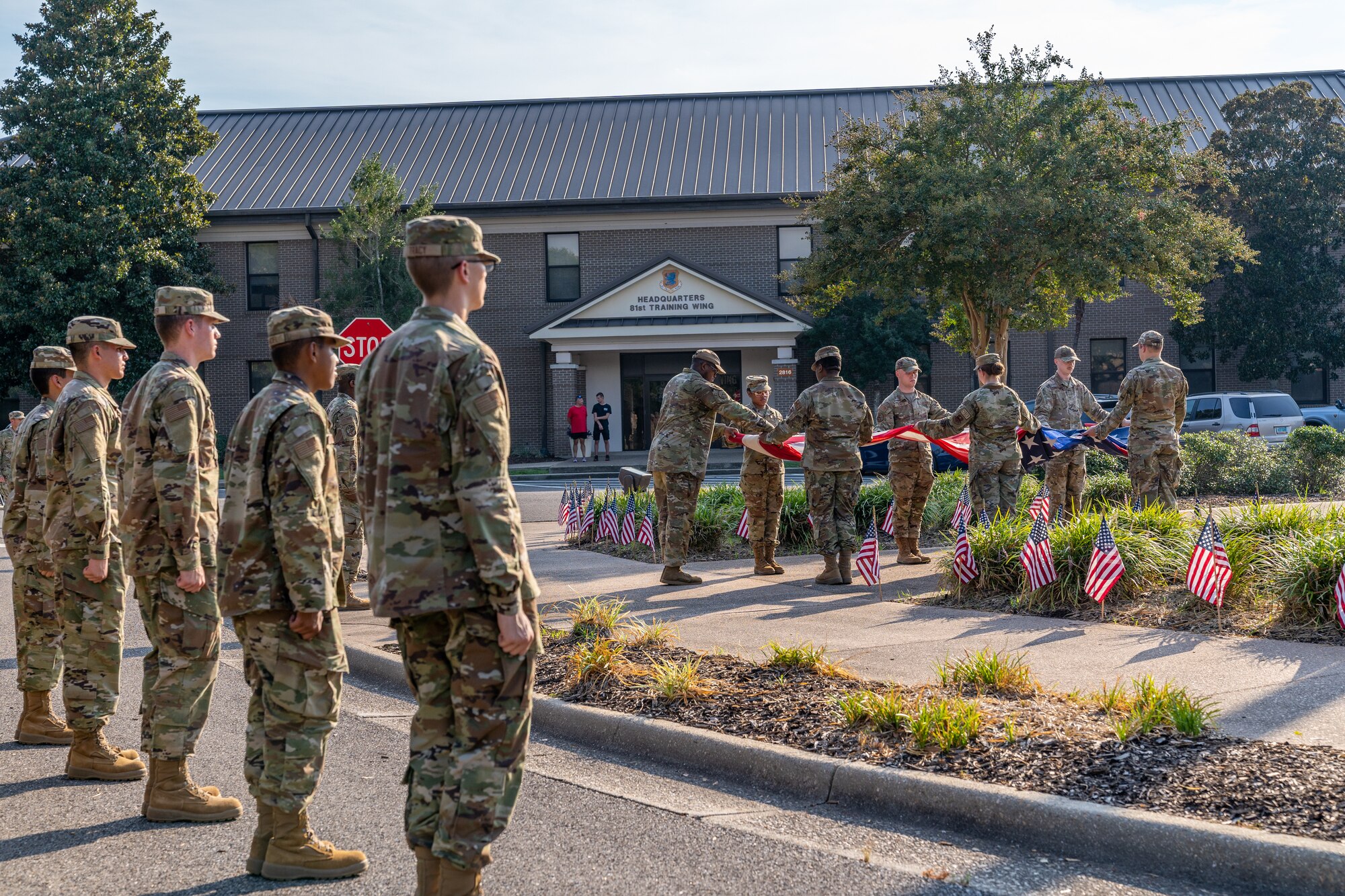 81st Training Wing Airmen fold the national colors during the POW/MIA Retreat Ceremony at Keesler Air Force Base, Mississippi, Sept. 15, 2023.