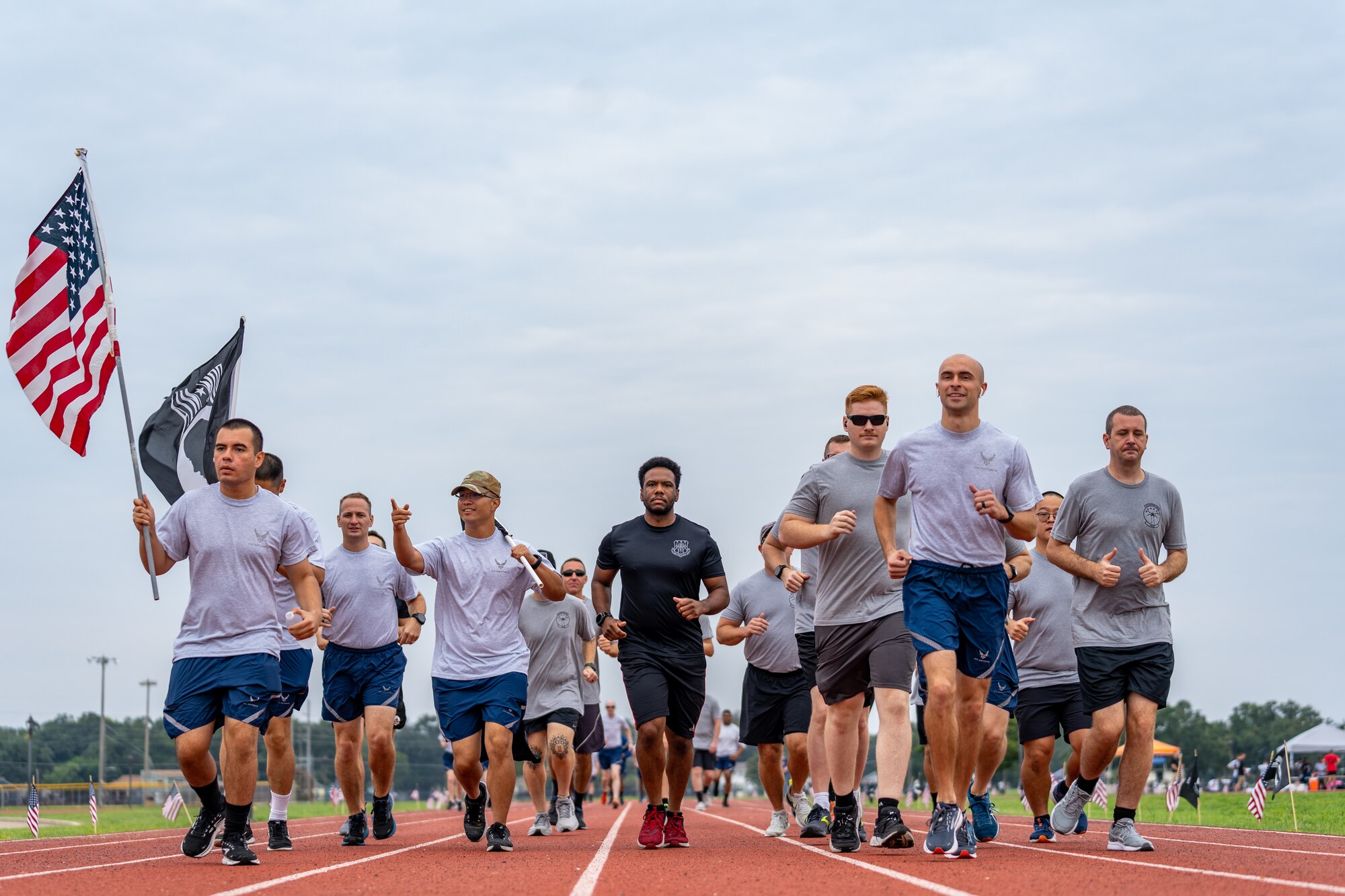 U.S. Airmen from the 81st Training Wing run on the Triangle Track in honor of National POW/MIA Recognition Day at Keesler Air Force Base, Mississippi, Sept. 15, 2023.