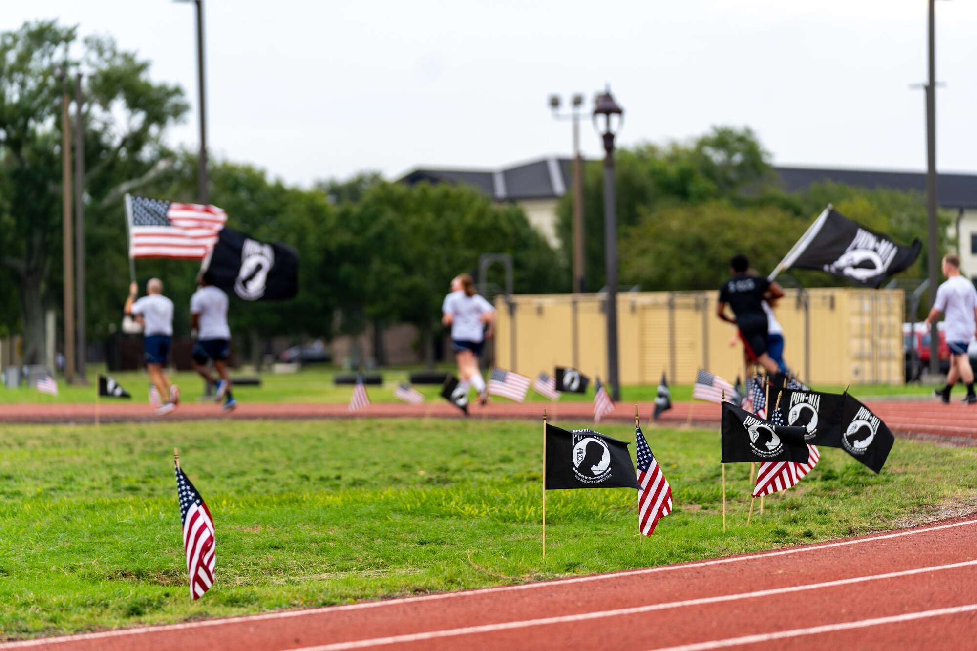 U.S. Airmen from the 81st Training Wing run on the Triangle Track in honor of National POW/MIA Recognition Day at Keesler Air Force Base, Mississippi, Sept. 15, 2023.