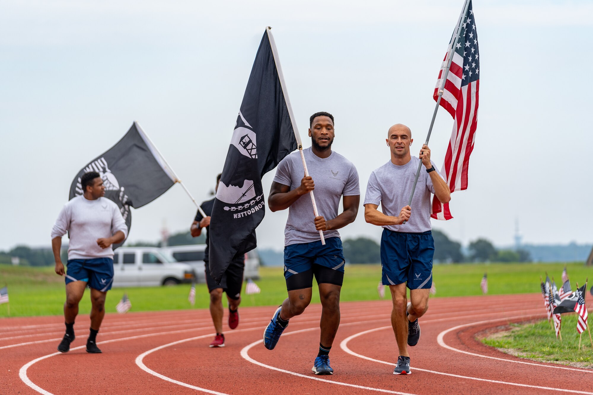 U.S. Airmen from the 81st Training Wing run on the Triangle Track in honor of National POW/MIA Recognition Day at Keesler Air Force Base, Mississippi, Sept. 15, 2023.