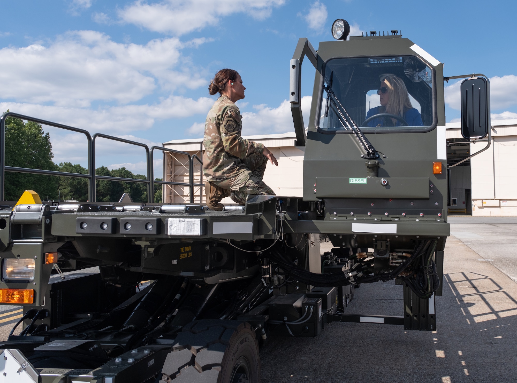 AFRC civic leader operates a 25K Halvorsen Loader