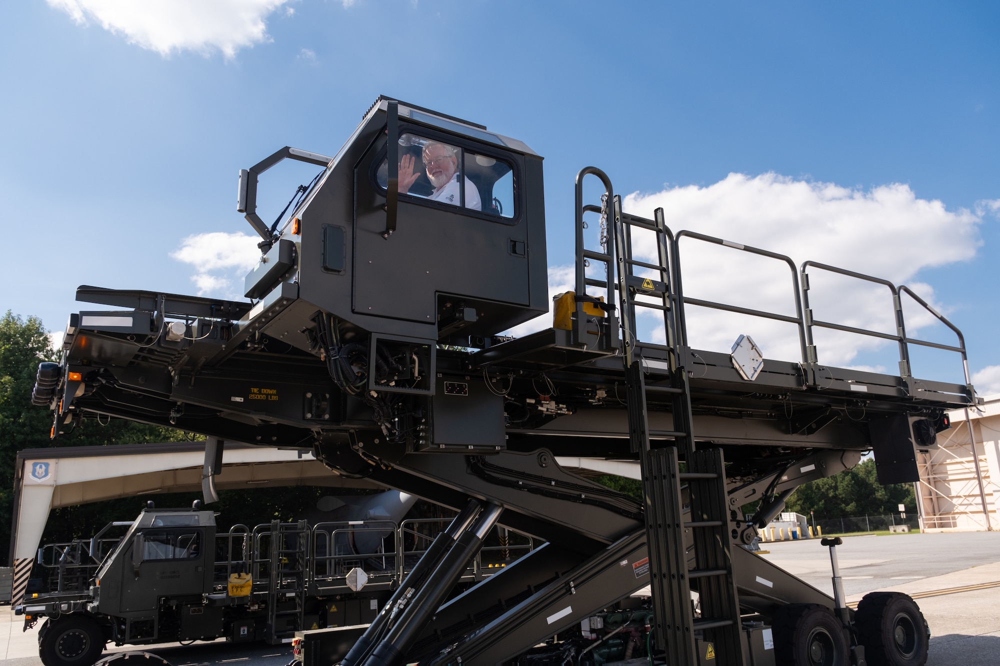 Air Force Reserve Command (AFRC) civic leader operates a 25K Halvorsen Loader