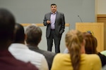 Keynote speaker, Eduardo Villavicecio, conversation curator, interactive facilitator and MotivActional speaker, discusses how growing up Latino affected the way he lives his life now at the Defense Logistics Agency Troop Support's annual National Hispanic Heritage Month event Sept. 19.