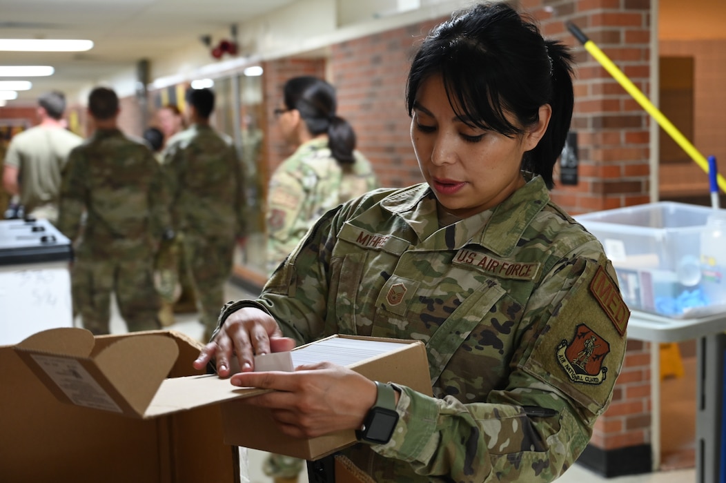 Image of an Airman working with patients.