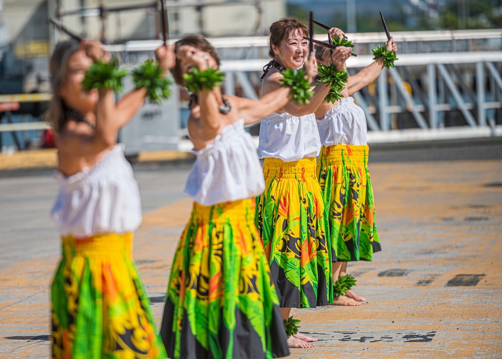 Hula dancers perform as the Navy's newest Arleigh Burke-class guided-missile destroyer, USS Frank E. Petersen Jr. (DDG 121) arrives at its new homeport, Joint Base Pearl Harbor-Hickam, after completing its maiden voyage from Charleston, South Carolina where the ship was commissioned. (U.S. Navy photo by Melvin J. Gonzalvo)