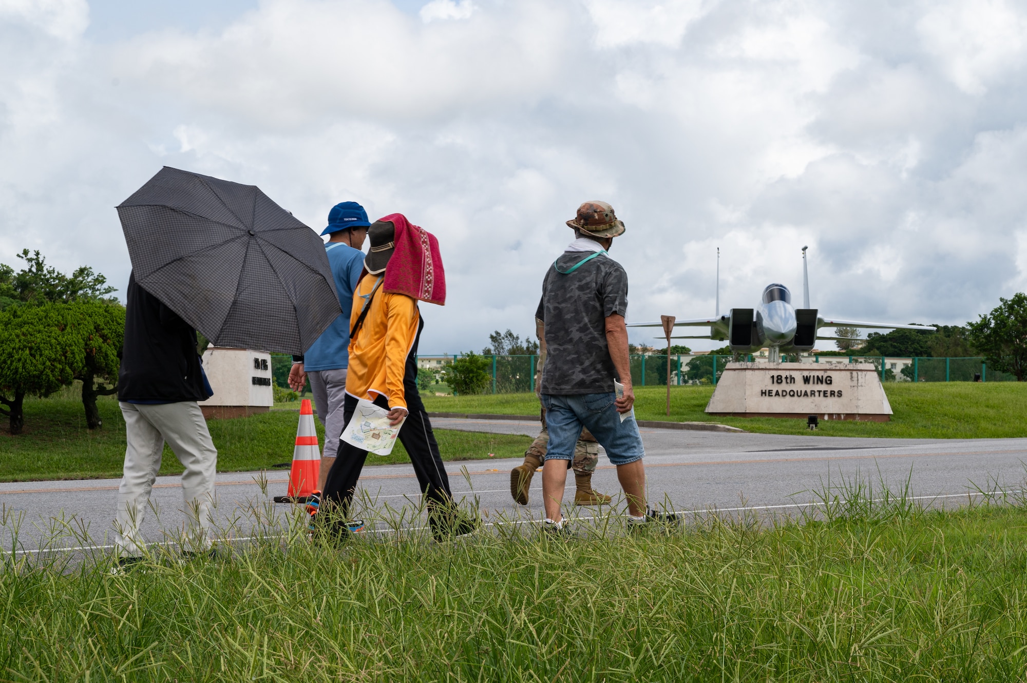 Participants walk past a static display aircraft.