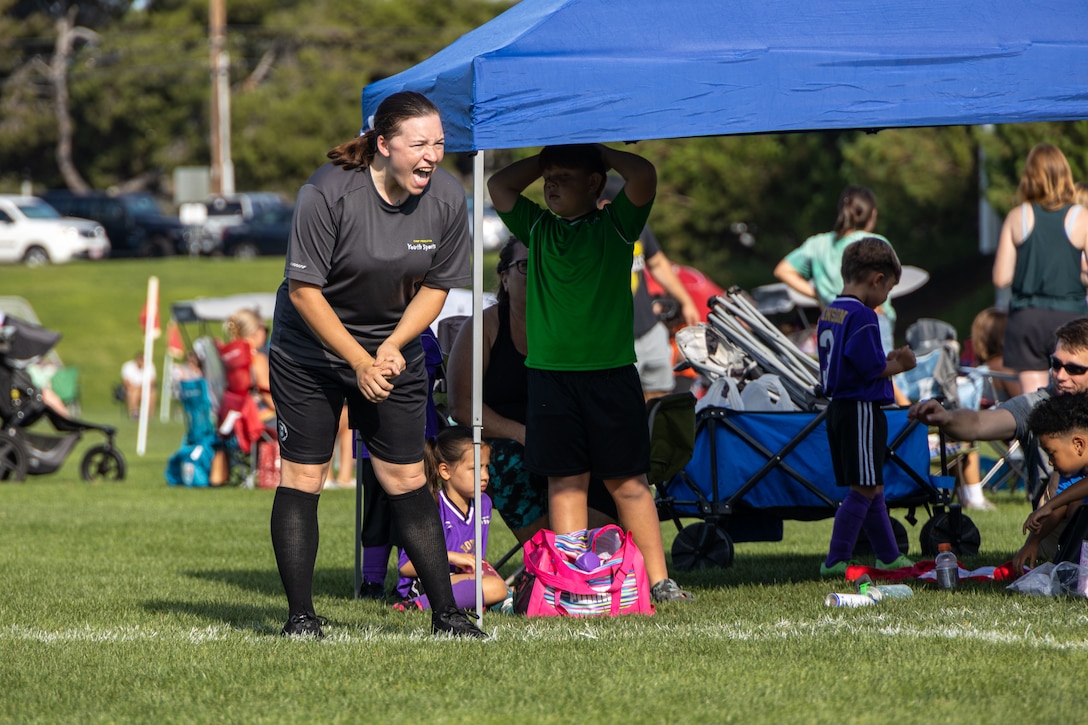 2023 MCB Camp Pendleton Volunteer of the Year (SOI-West Sgt Julia Sarullo):   U.S. Marine Corps Sgt. Julia Sarullo, a financial management resource analyst and comptroller chief at School of Infantry - West, Marine Corps Base Camp Pendleton, California, coaches the goalie of her Camp Pendleton Youth Sports U-6 Start Smart Soccer Team, after their game at the 11 Area parade deck at MCB Camp Pendleton, California, Sept. 9, 2023. Sarullo, a native of Johnstown, New York was recognized as the 2023 MCB Camp Pendleton Volunteer of the Year for her dedication of over 2,000 hours of community service to Camp Pendleton and neighboring communities. (U.S. Marine Corps photo by Lance Cpl. Mary Jenni)