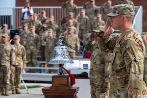 Staff Sgt. Jason Helgeson, a firefighter assigned to the 92nd Civil Engineer Squadron, salutes while the national anthem plays during a 9/11 Retreat Ceremony at Fairchild Air Force Base.