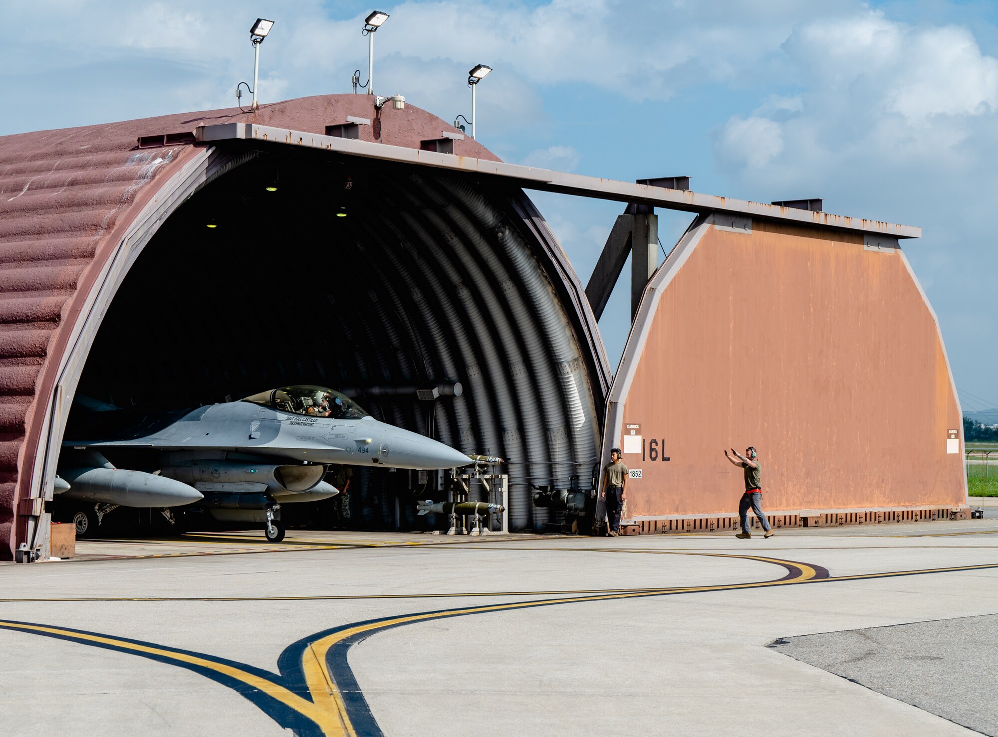 Photo of an aircraft exiting a hangar