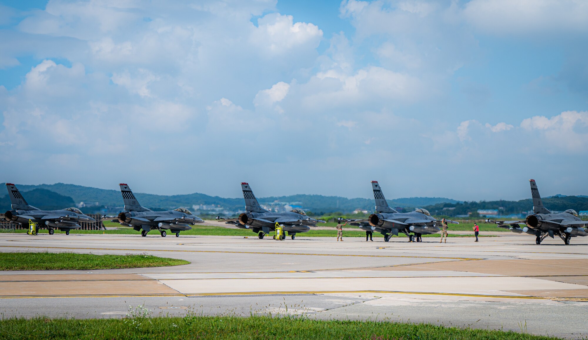Photo of aircraft lined up on a flightline