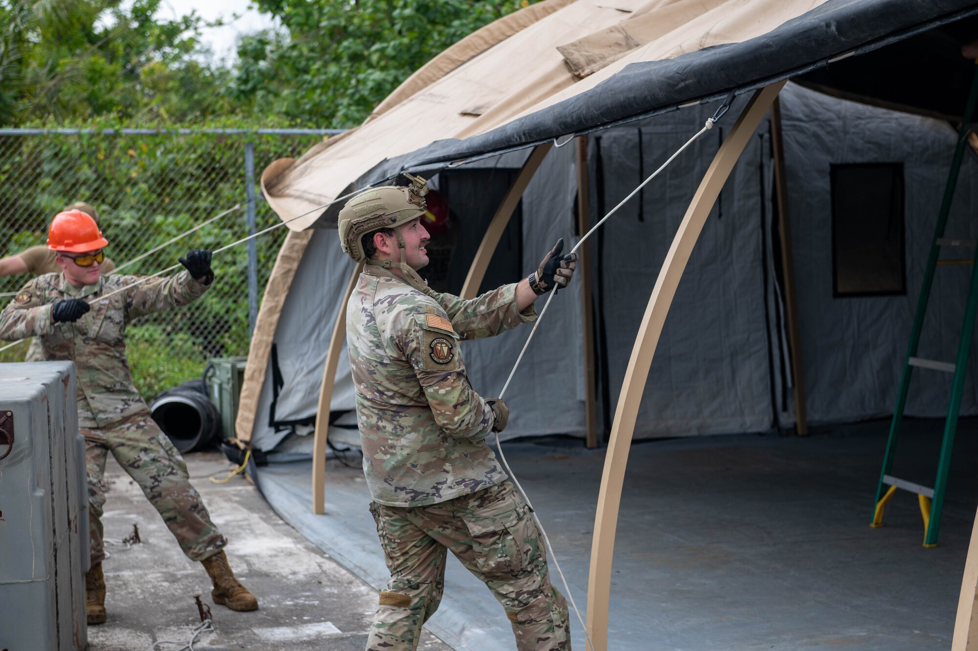 U.S. Air Force Airmen, assigned to the 36th Civil Engineering Squadron, build a tent during Prime Base Engineer Emergency Force training on Andersen Air Force Base, Guam, Sept. 19, 2023. Airmen assigned to the 36th Civil Engineering Squadron participated in the Prime BEEF training once a month. (U.S. Air Force photo by Airman Allon Lapaix)