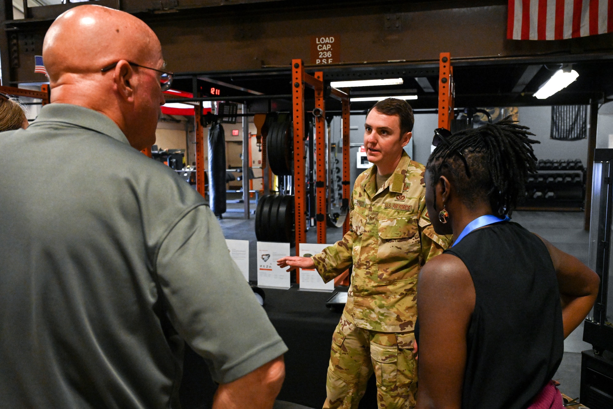 An Airman briefs people.