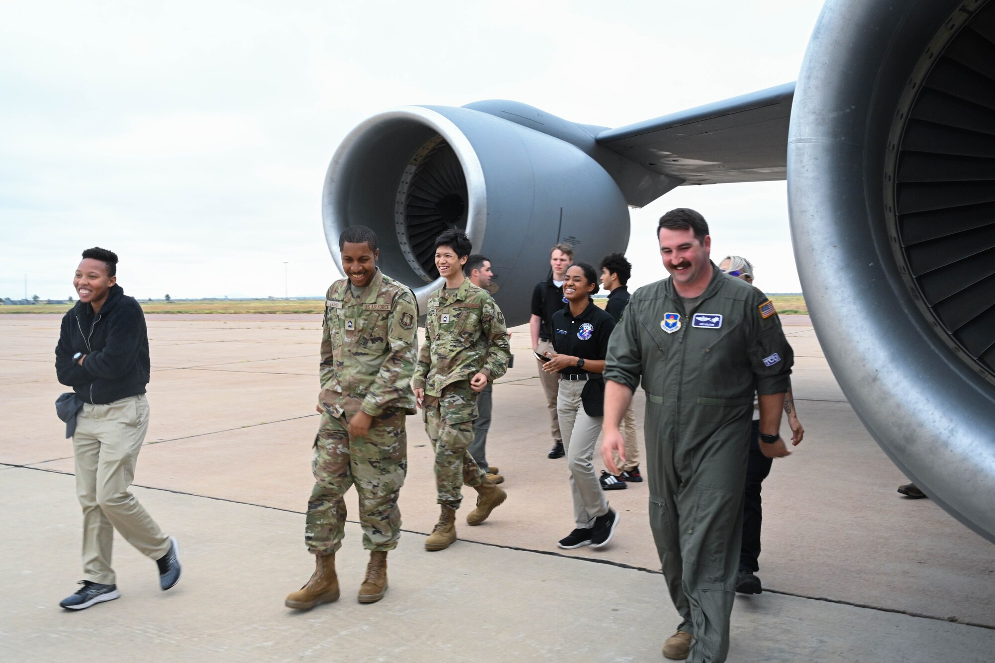 U.S. Air Force Maj. Joe Wolfer, Detachment 845 operations flight commander, guides Air Force ROTC Det. 845 cadets on a tour of a KC-135 Stratotanker at Altus Air Force Base (AFB), Oklahoma, Sept. 14, 2023. The students learned about the capabilities of the aircraft and the mission of Altus AFB. (U.S. Air Force photo by Airman 1st Class Miyah Gray)