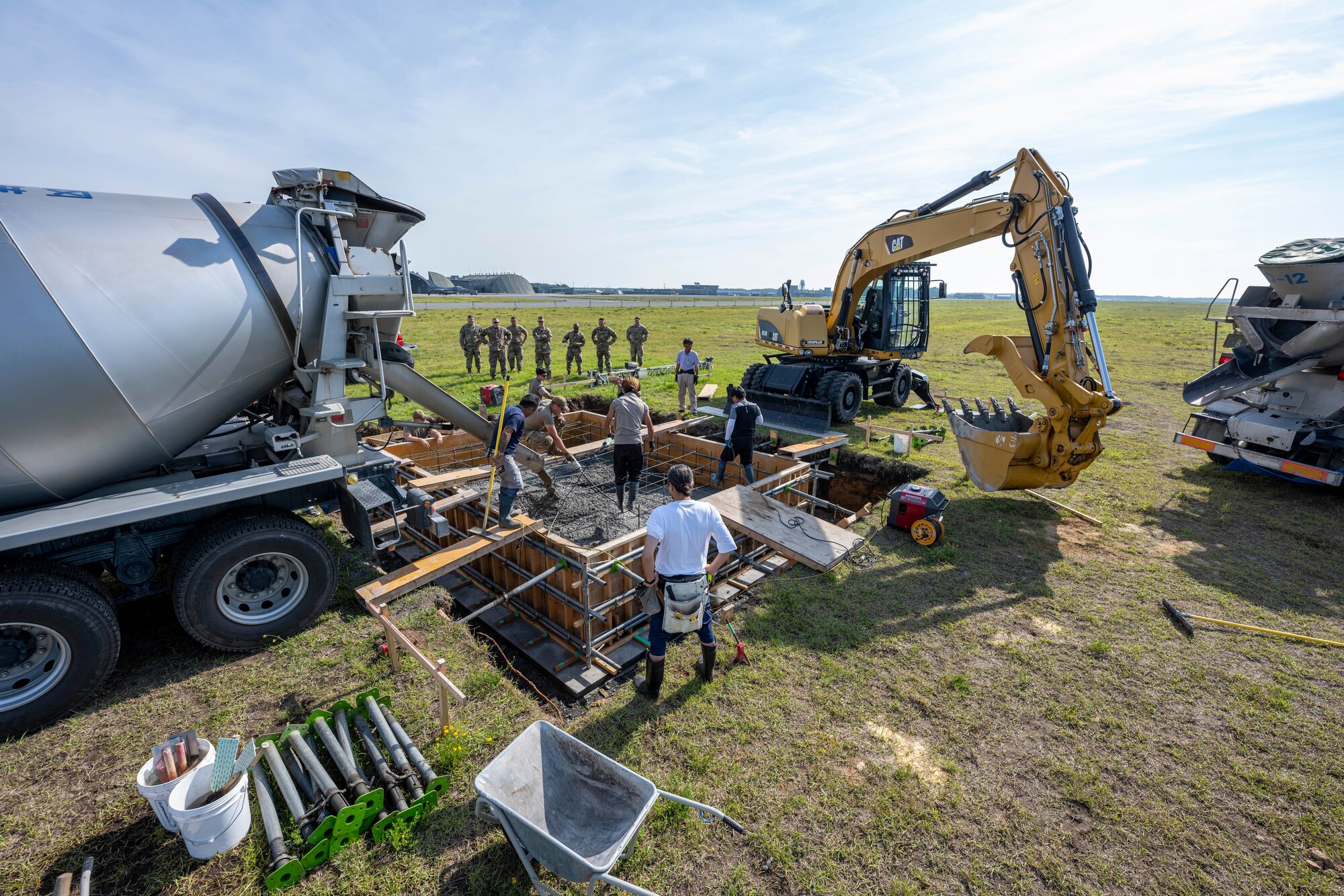 A construction site with heavy machinery vehicles around it.