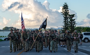The Color Guard stands in uniform presenting the colors.