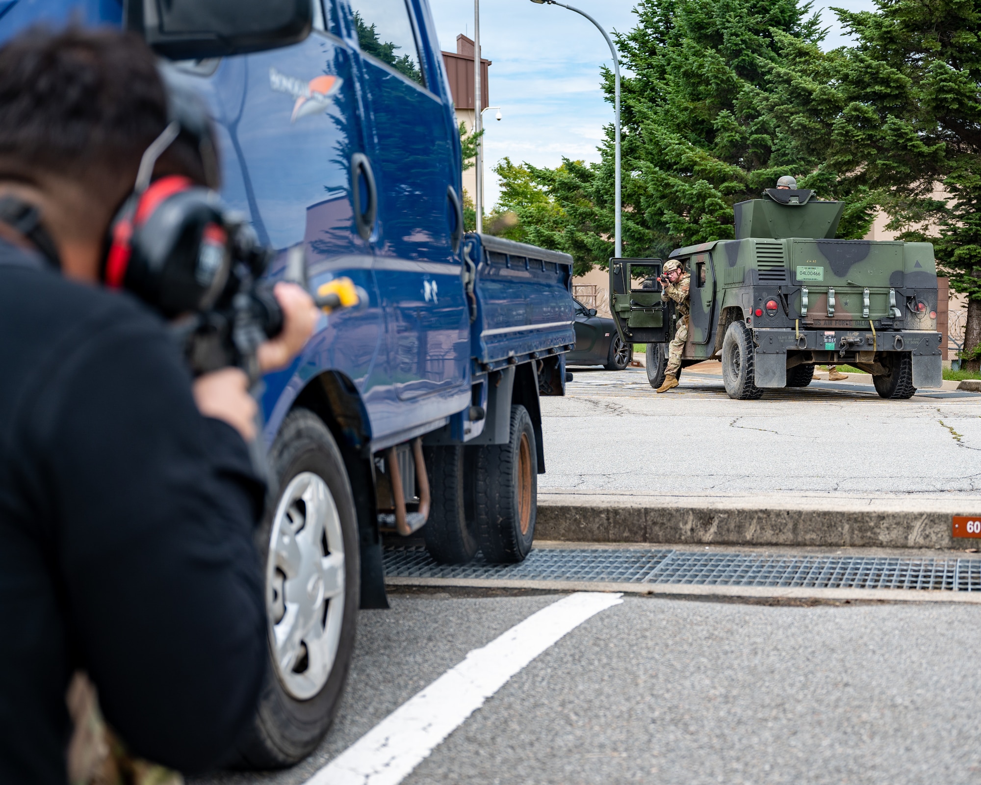 U.S. Air Force Senior Airman Joseph DeJesus, 51st Maintenance Squadron aerospace ground equipment technician, engages 51st Security Forces Squadron Defenders while assuming the role of opposing forces during a simulated ground attack at Osan Air Base, Republic of Korea, Sept. 21, 2023. By incorporating OPFOR in these scenarios, Airmen can undergo training in a safe, yet high stress environment while simultaneously gaining invaluable experience in encountering hostile ground forces. (U.S. Air Force photo by Staff Sgt. Thomas Sjoberg)