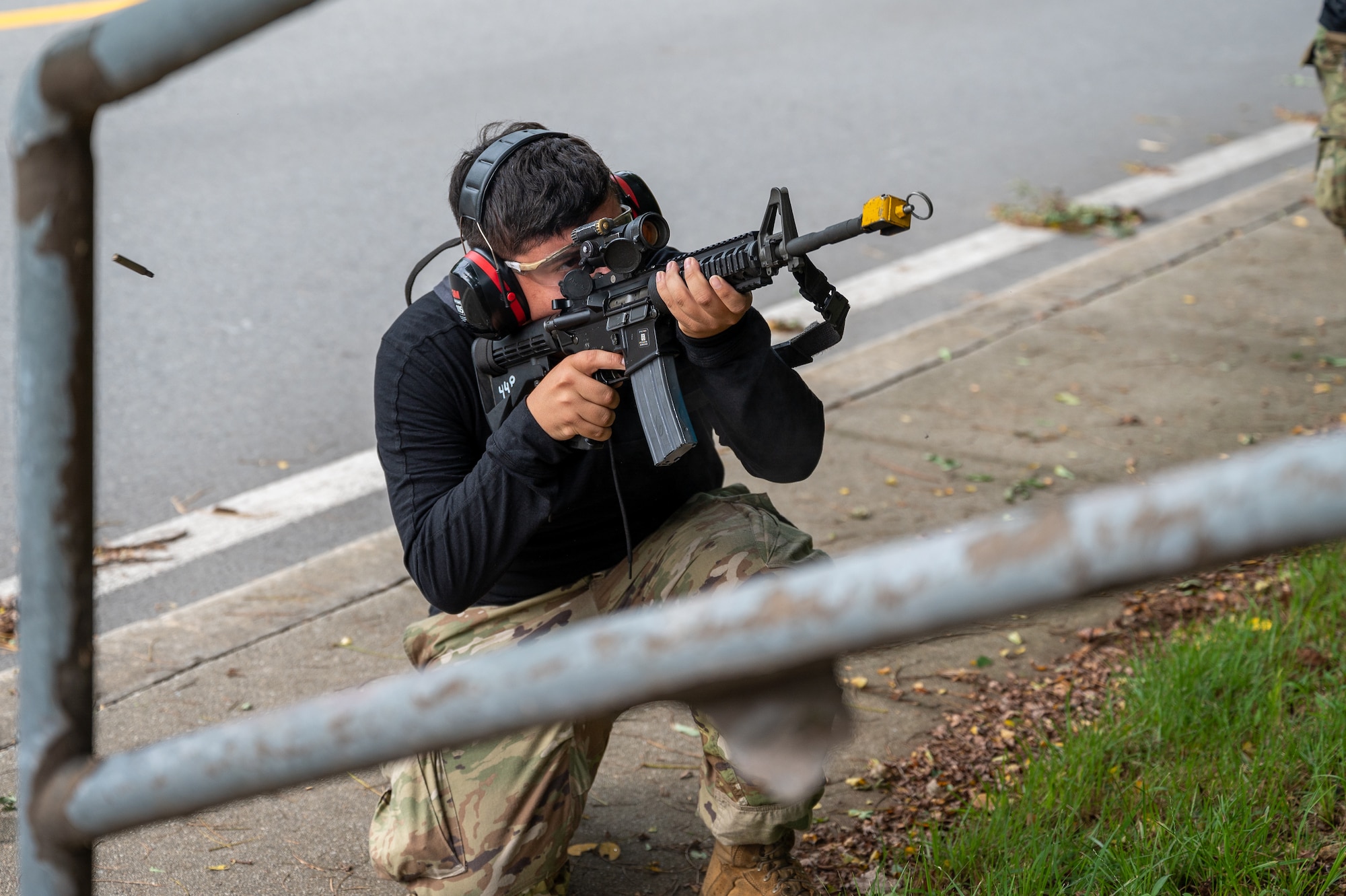 U.S. Air Force Senior Airman Joseph DeJesus, 51st Maintenance Squadron aerospace ground equipment technician, engages 51st Security Forces Squadron Defenders and augmentees while assuming the role of opposing forces during a simulated ground attack at Osan Air Base, Republic of Korea, Sept. 21, 2023. The importance of simulated ground attacks lies in providing Airmen with realistic experiences, preparing them to face ground threats with confidence and competence. (U.S. Air Force photo by Staff Sgt. Thomas Sjoberg)