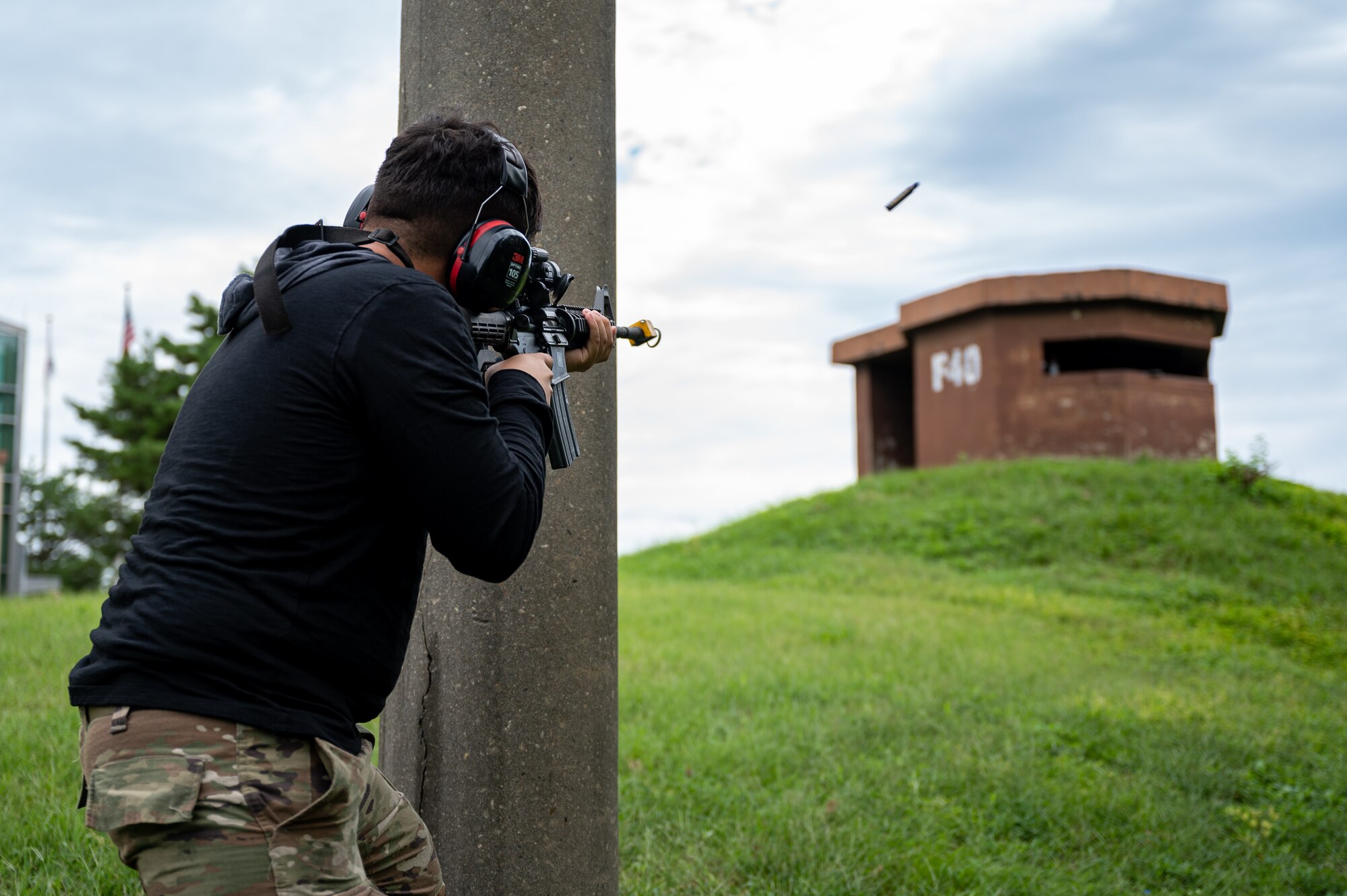 U.S. Air Force Senior Airman Joseph DeJesus, 51st Maintenance Squadron aerospace ground equipment technician, engages 51st Security Forces Squadron Defenders and augmentees while assuming the role of opposing forces during a simulated ground attack at Osan Air Base, Republic of Korea, Sept. 21, 2023. The importance of simulated ground attacks lies in providing Airmen with realistic experiences, preparing them to face ground threats with confidence and competence. (U.S. Air Force photo by Staff Sgt. Thomas Sjoberg)