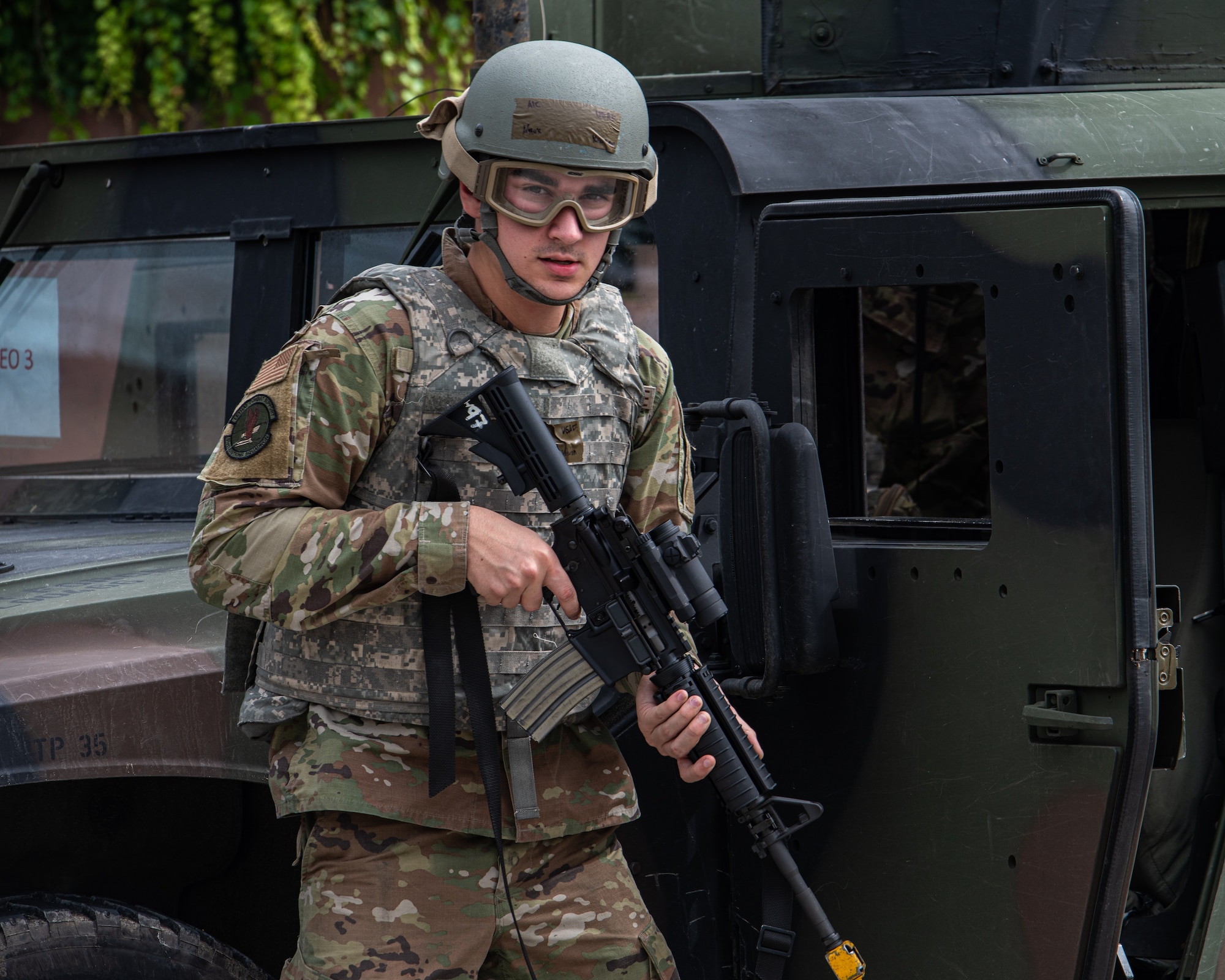 U.S. Air Force Airman 1st Class Keaton Knox, 51st Munitions Squadron armament maintainer, scans the area for opposing forces during a simulated attack at Osan Air Base, Republic of Korea, Sept. 21, 2023. Having Airmen trained to augment as security forces personnel increases the number of multi- capable Airmen that can effectively engage and counter threats. (U.S. Air Force photo by Airman 1st Class Chase Verzaal)