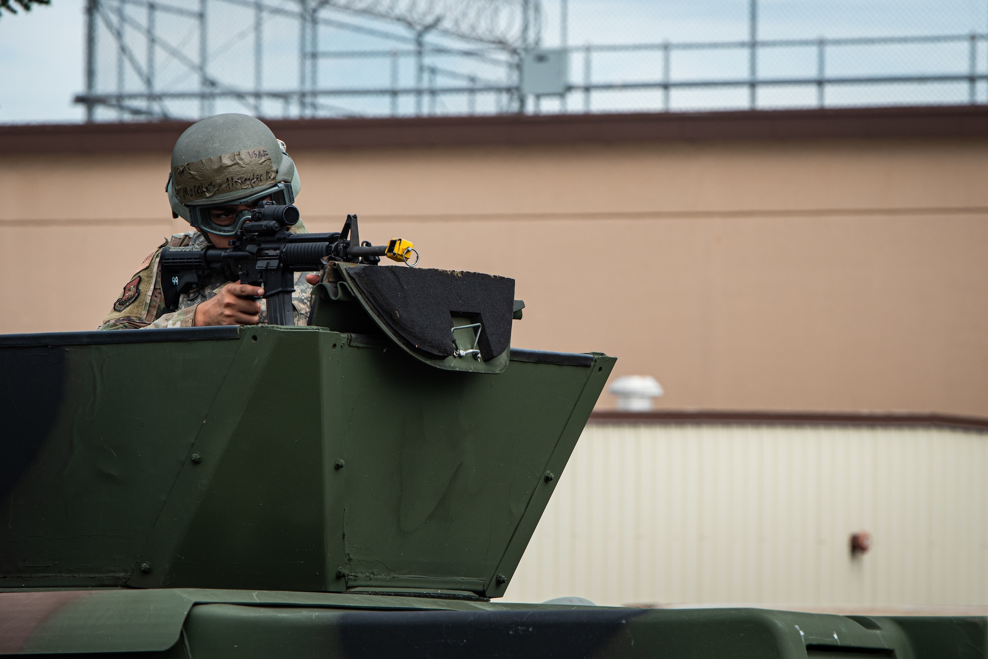 U.S. Air Force Senior Airman Alexander Morales, 51st Fighter Wing paralegal, engages opposing forces during a simulated attack at Osan Air Base, Republic of Korea, Sept. 21, 2023. Simulated ground attacks enhance 51st Security Forces Squadron Defenders ability to respond to real-world threats while augmented Airmen provide additional support. (U.S. Air Force photo by Airman 1st Class Chase Verzaal)