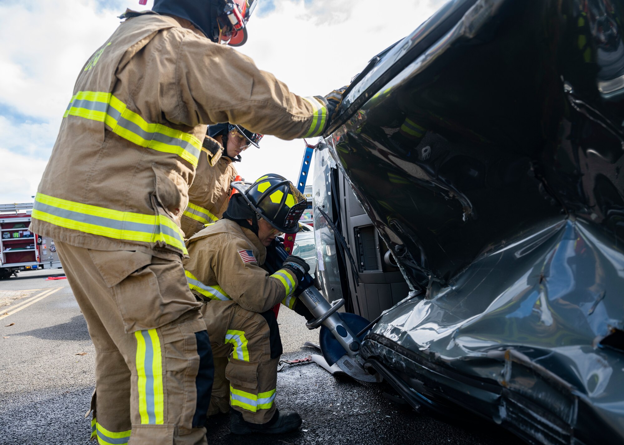 The exercise allowed 100th CES firefighters to use their expertise to perform a vehicle extraction where simulated mannequins are trapped in a wrecked vehicle.
