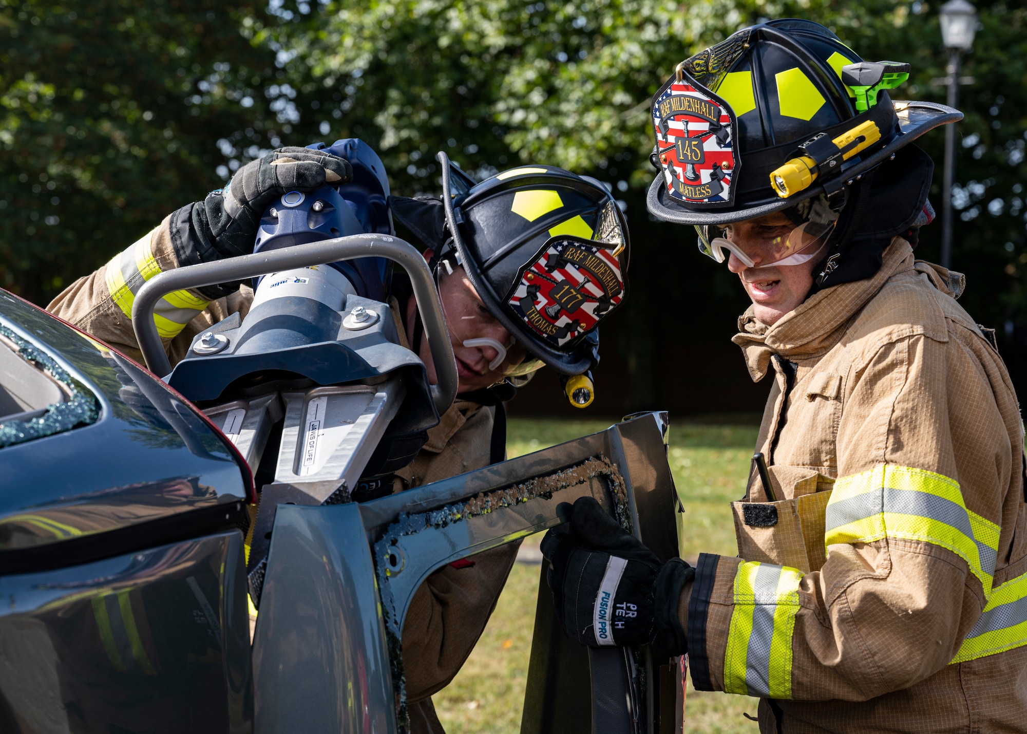The exercise allowed 100th CES firefighters to use their expertise to perform a vehicle extraction where simulated mannequins are trapped in a wrecked vehicle.