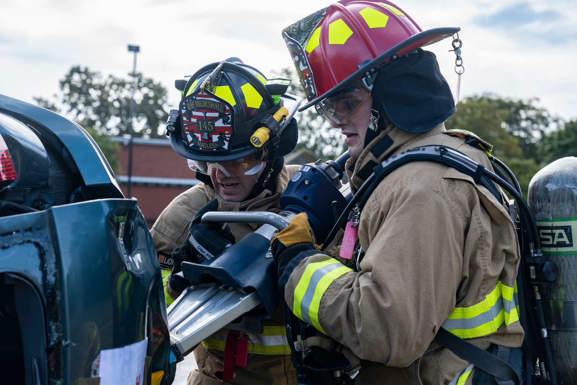 The exercise allowed 100th CES firefighters to use their expertise to perform a vehicle extraction where simulated mannequins are trapped in a wrecked vehicle.