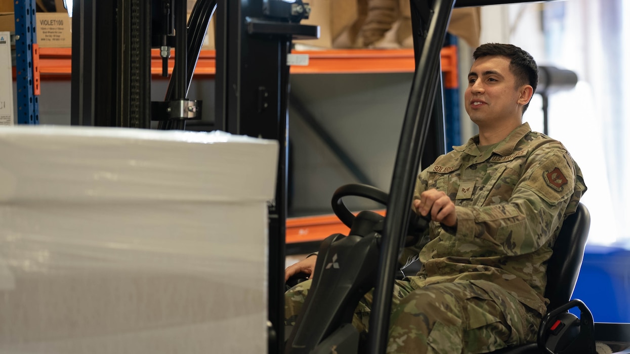 Image of an Airman operating a forklift.