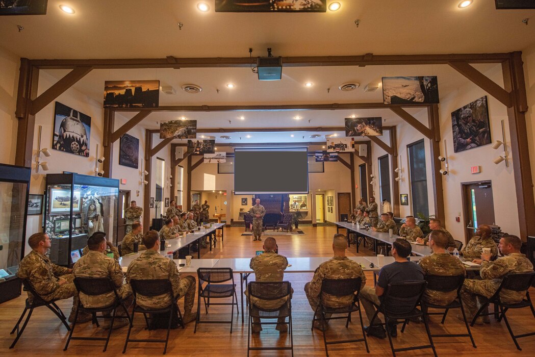U.S. Air Force Col. Tim Hood, 93rd Air Ground Operations Wing commander, briefs senior leaders as part of their Commander’s Conference, Sept. 19, 2023, at Moody Air Force Base, Georgia. The 93rd AGOW used the conference as a meaningful opportunity for their geographically separated units to gather in one place and coordinate their efforts as leaders. (The slide has been redacted for OPSEC purposes) (U.S. Air Force photo by Airman 1st Class Sir Wyrick)
