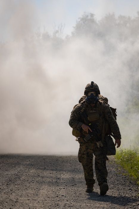 U.S. Marine Corps Sgt. Justin Gipson, infantry rifleman, Intelligence Support Battalion, Marine Forces Reserve, conducts a patrol during the Force Headquarters Group Super Squad Competition at Joint Base Elmendorf-Richardson, Alaska, July, 23, 2023. During the multi-day competition, reserve units from all across the Marine Corps, exercised their technical and tactical proficiencies by competing in events that highlighted offensive/defensive operations, patrolling techniques, combat marksmanship, physical endurance and small unit leadership. (U.S. Marine Corps photo by Cpl. Mitchell Johnson)
