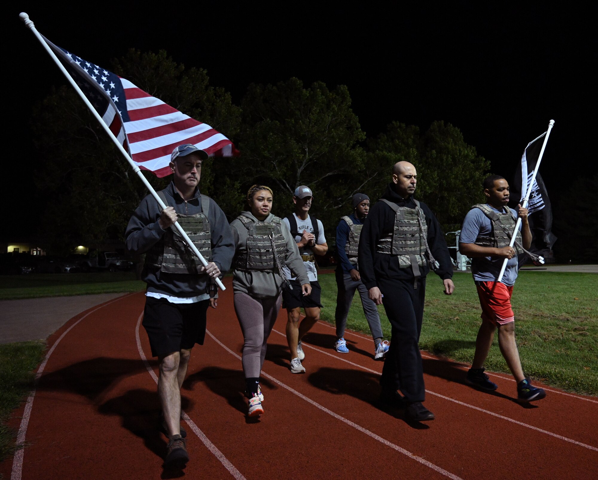 Airmen ruck with flags