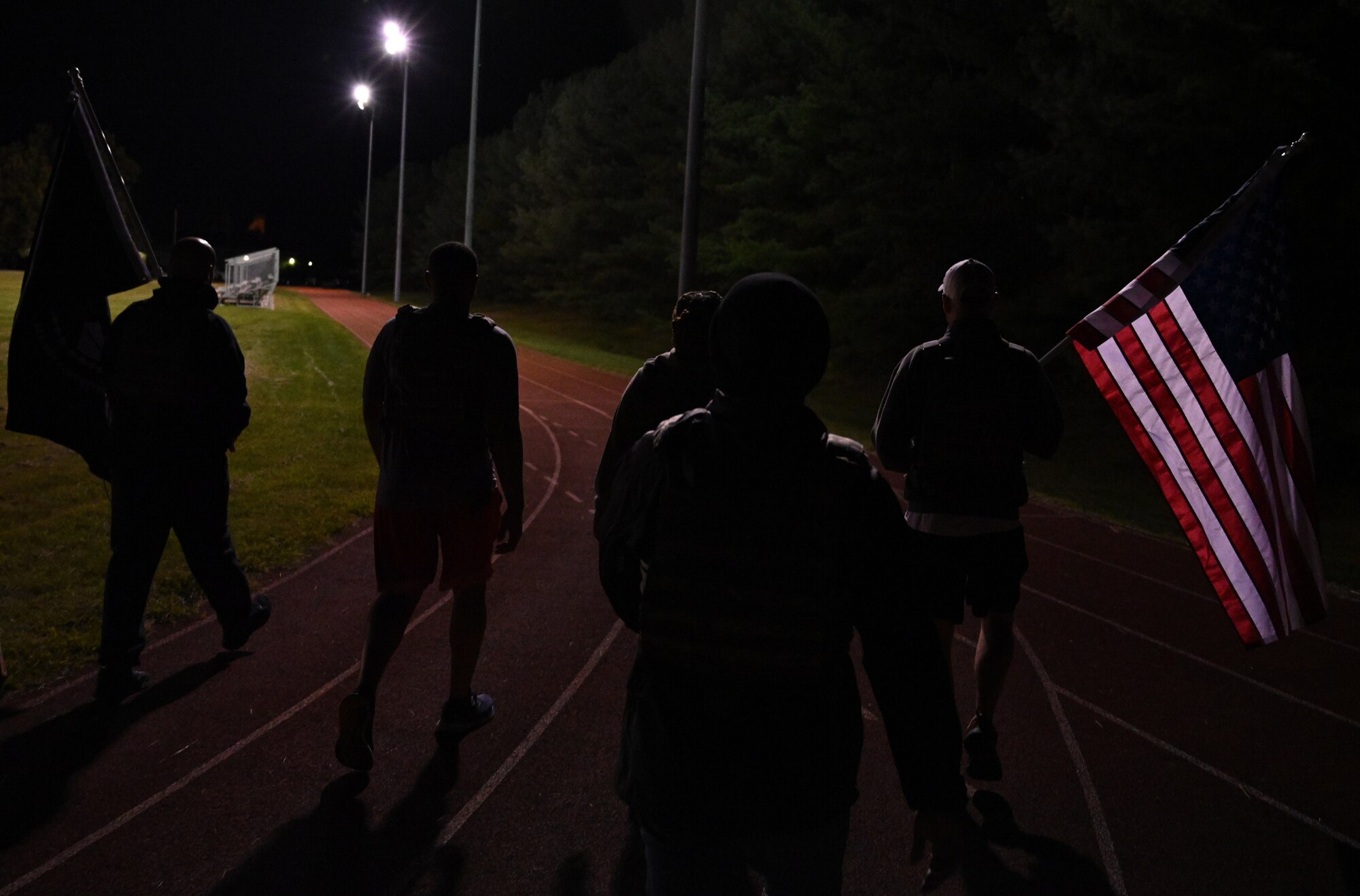 Airmen ruck with flags