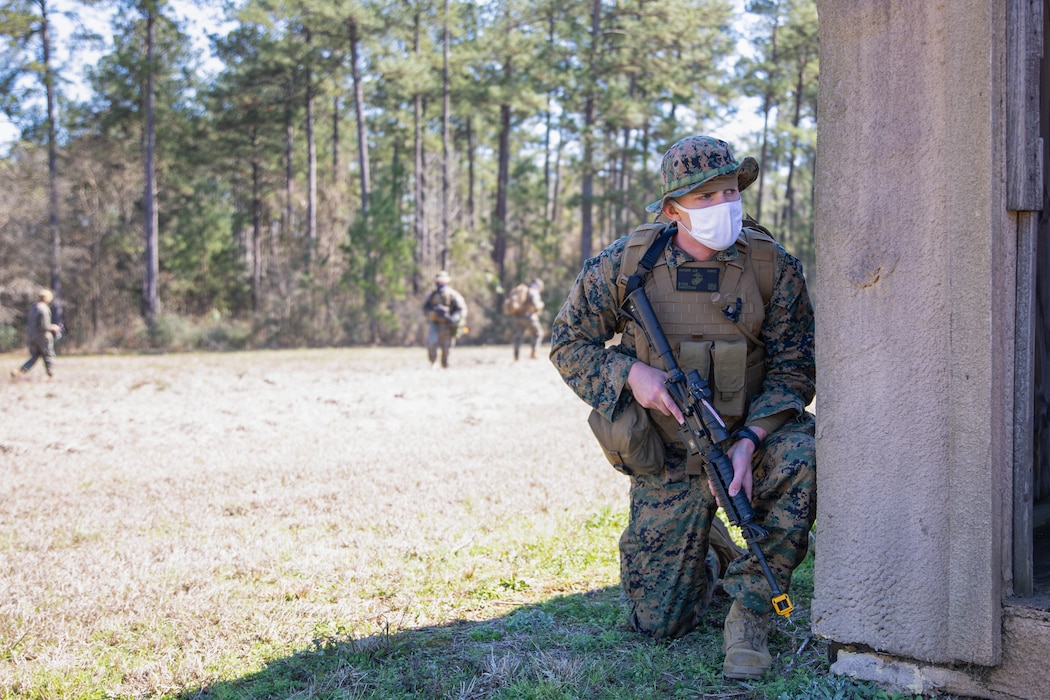 Lance Cpl. Jacob Adams, a field radio operator for Battlespace Surveillance Company, provides security for fellow Marines during a reconnaissance and surveillance field exercise on Camp Shelby, Miss., Feb. 19, 2021. This training develops and refines platoon and section patrolling and increases proficiency in ground sensor operations. (U.S. Marine Corps photo by Lance Cpl. Mitchell Collyer)
