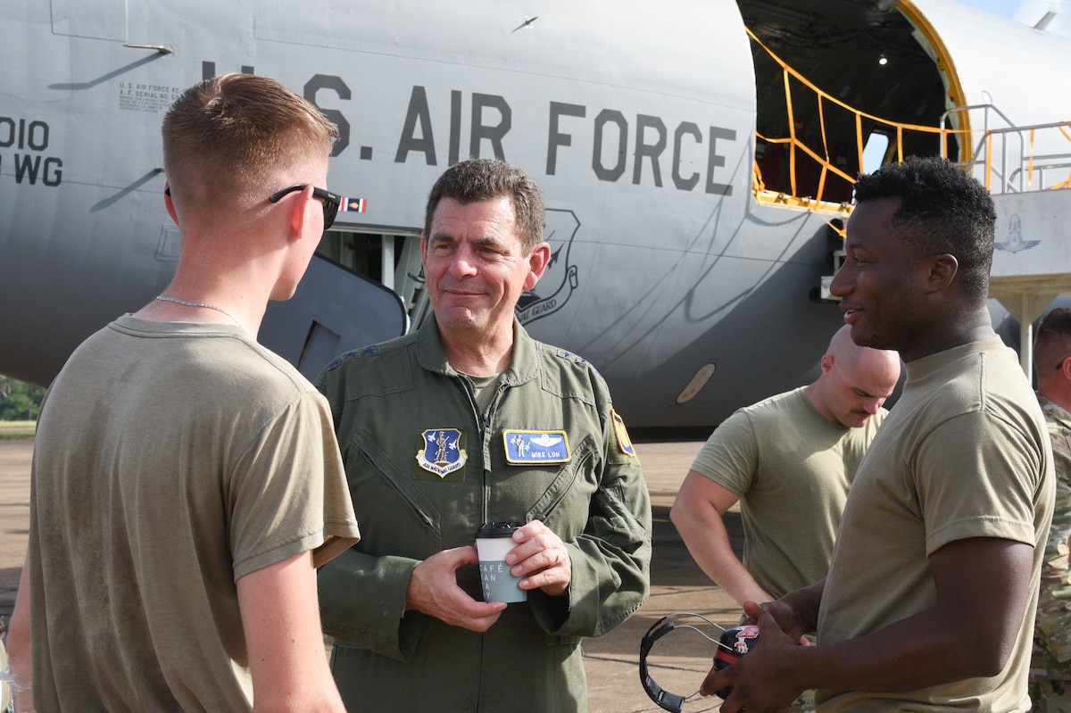 Lt. Gen. Michael Loh, Director Air National Guard, greets 142nd Wing Airmen before take off on the KC-135 Stratotanker on Korat Air Base, Royal Kingdom of Thailand for Enduring Partners 2023, Sept. 19, 2023. The general and his staff visited to see the State Partnership Program engagement between the Kingdom of Thailand, the Washington and Oregon Air National Guard. The KC-135 Stratotanker is an aerial refueling tanker aircraft that has the capability of carrying up to 83,000 pounds of cargo. (U.S. Air National Guard photo by Senior Airman Yuki Klein)