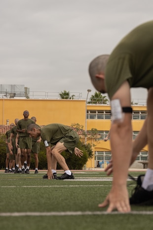 U.S. Marine Corps recruits with Kilo Company, 3rd Recruit Training Battalion, execute a shuttle run during a physical training session at Marine Corps Recruit Depot San Diego, Sept. 19, 2023. Physical training challenges recruits to strengthen themselves physically and mentally. (U.S. Marine Corps photo by Lance Cpl. Janell B. Alvarez)