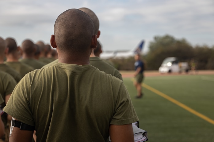 U.S. Marine Corps recruits with Kilo Company, 3rd Recruit Training Battalion, arrive at the track to perform a physical training session at Marine Corps Recruit Depot San Diego, Sept. 19, 2023. Physical training challenges recruits to strengthen themselves physically and mentally. (U.S. Marine Corps photo by Lance Cpl. Janell B. Alvarez)