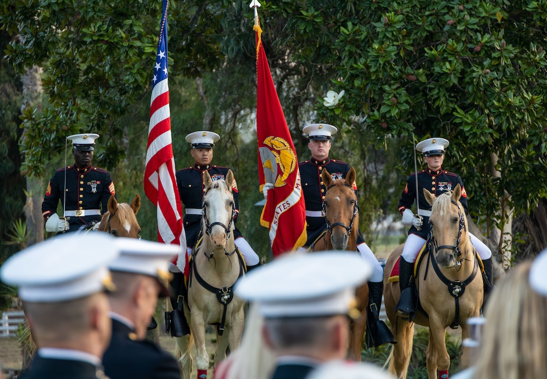 U.S. Marines with the Marine Corps Mounted Color Guard, Marine Corps Logistics Base Barstow, present the colors during the 81st annual Evening Colors Ceremony at the Santa Margarita Ranch House on Marine Corps Base Camp Pendleton, California, Sept. 20, 2023. The annual ceremony is held to recognize the base’s history, legacy, importance and the commemoration of the official dedication of Camp Pendleton. President Franklin D. Roosevelt dedicated the installation Sept. 25, 1942, in honor of World War I Maj. Gen. Joseph H. Pendleton, who had long advocated the establishment of a West Coast training base. (U.S. Marine Corps photo by Lance Cpl. Mary Jenni)