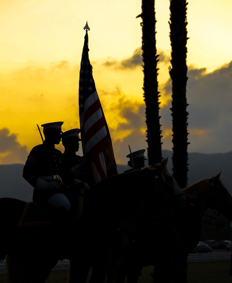 U.S. Marines with the Marine Corps Mounted Color Guard, Marine Corps Logistics Base Barstow, present the colors during the 81st annual Evening Colors Ceremony at the Santa Margarita Ranch House on Marine Corps Base Camp Pendleton, California, Sept. 20, 2023. The annual ceremony is held to recognize the base’s history, legacy, importance and the commemoration of the official dedication of Camp Pendleton. President Franklin D. Roosevelt dedicated the installation Sept. 25, 1942, in honor of World War I Maj. Gen. Joseph H. Pendleton, who had long advocated the establishment of a West Coast training base. (U.S. Marine Corps photo by Lance Cpl. Mary Jenni).
