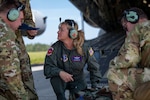 Col. Teri Neely, commander of the 183rd Aeromedical Evacuation Squadron, Jackson, Mississippi, receives the status of a simulated patient during Operation Iron Magnolia at Camp Shelby Joint Forces Training Center Auxiliary Airfield, Hattiesburg, Mississippi, Sept. 9, 2023.