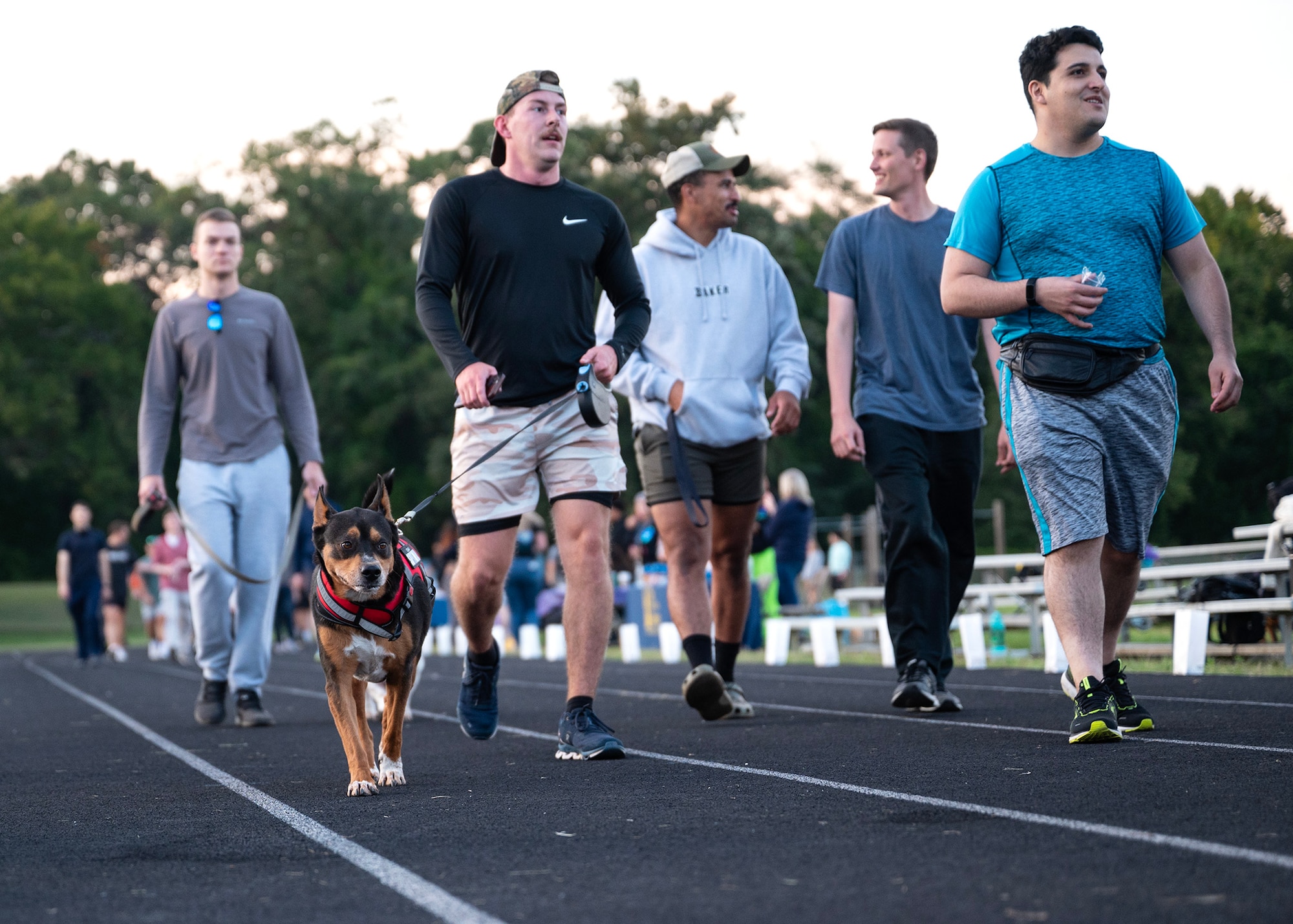 Fort George G. Meade community members participate in the 7th Annual Illuminating the Darkness event, Sept. 21, 2023, at Fort Meade, Maryland. The 70th Intelligence, Surveillance and Reconnaissance Wing partnered with Cryptologic Warfare Group SIX to host the overnight walk to remember people lost by suicide and offer support to all those affected. The event was open to the FGGM community and aimed to raise awareness about suicide prevention, remembering those who had been lost to suicide and offering support to all those affected. (U.S. Air Force photo by Tech. Sgt. Kevin Iinuma)