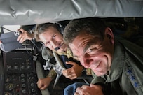 Lt. Gen. Michael Loh, director, Air National Guard, views the refueling of U.S. Air Force F-15 Eagles and Royal Thai Air Force F-16 Vipers from the boom pod alongside Senior Airman Eric Porter, 116th Air Refueling Squadron boom operator, near Korat Air Base, Royal Kingdom of Thailand, for Enduring Partners 2023, Sept. 19, 2023. The general and his staff visited to see the State Partnership Program engagement between the Kingdom of Thailand, the Washington and Oregon Air National Guard.