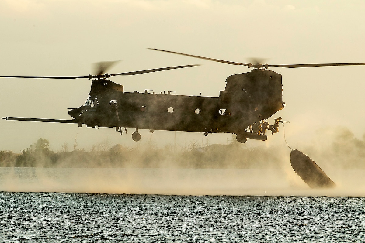 Air Force special operators exit a helicopter during a demonstration for the Joint Civilian Orientation Conference at Hurlburt Field, Fla., Sept. 20, 2023.