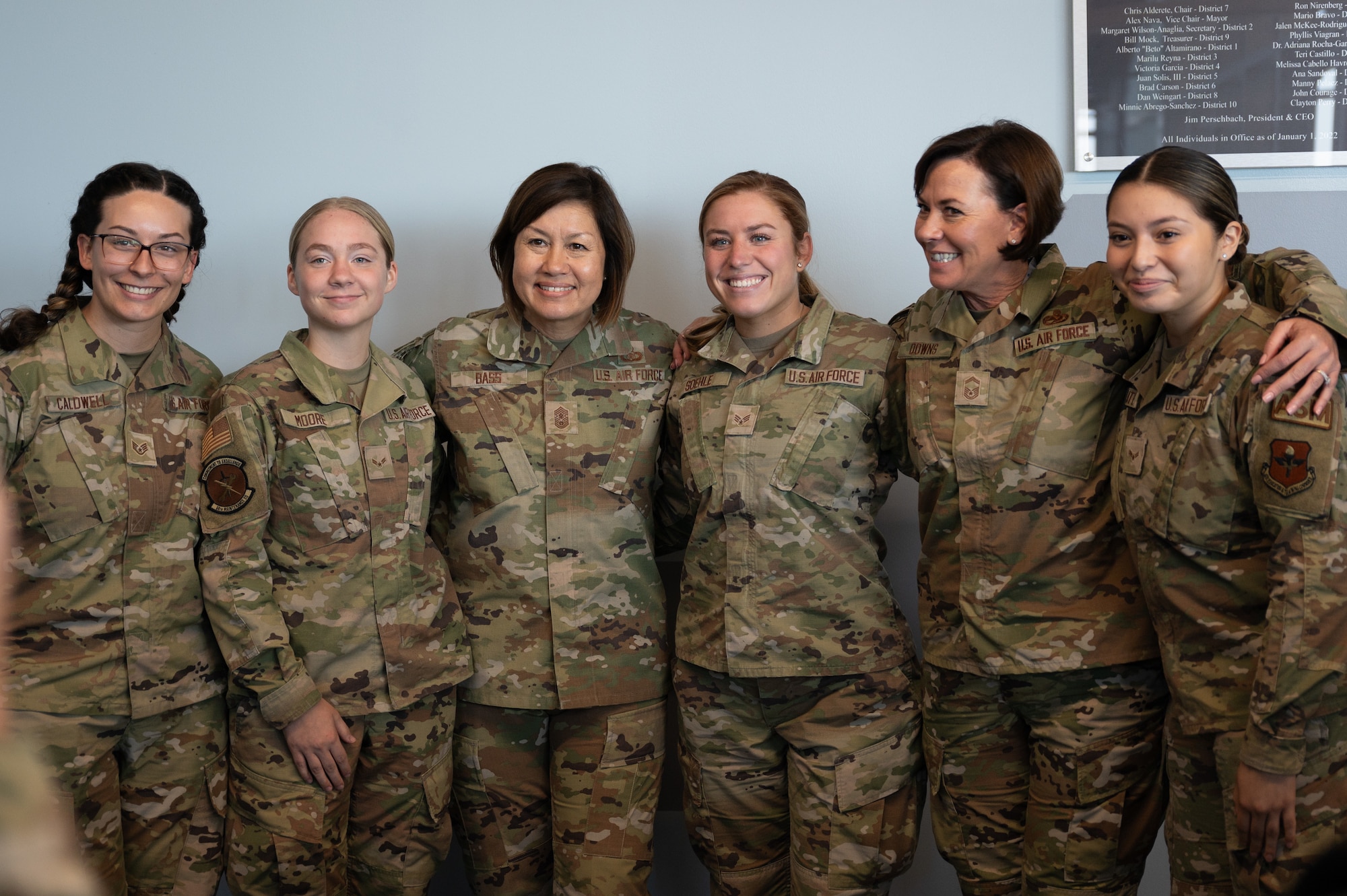 Chief Master Sgt. of the Air Force JoAnne Bass (third from the left) poses with Airmen for a group photo during Torch Athena Rally & Fly-In, San Antonio, Texas, Sept. 19, 2023. The three-day event aims to leverage education to enact change and inspire diverse female warfighter Airmen of the future. (U.S. Air Force photo by Airman 1st Class Gabriel Jones