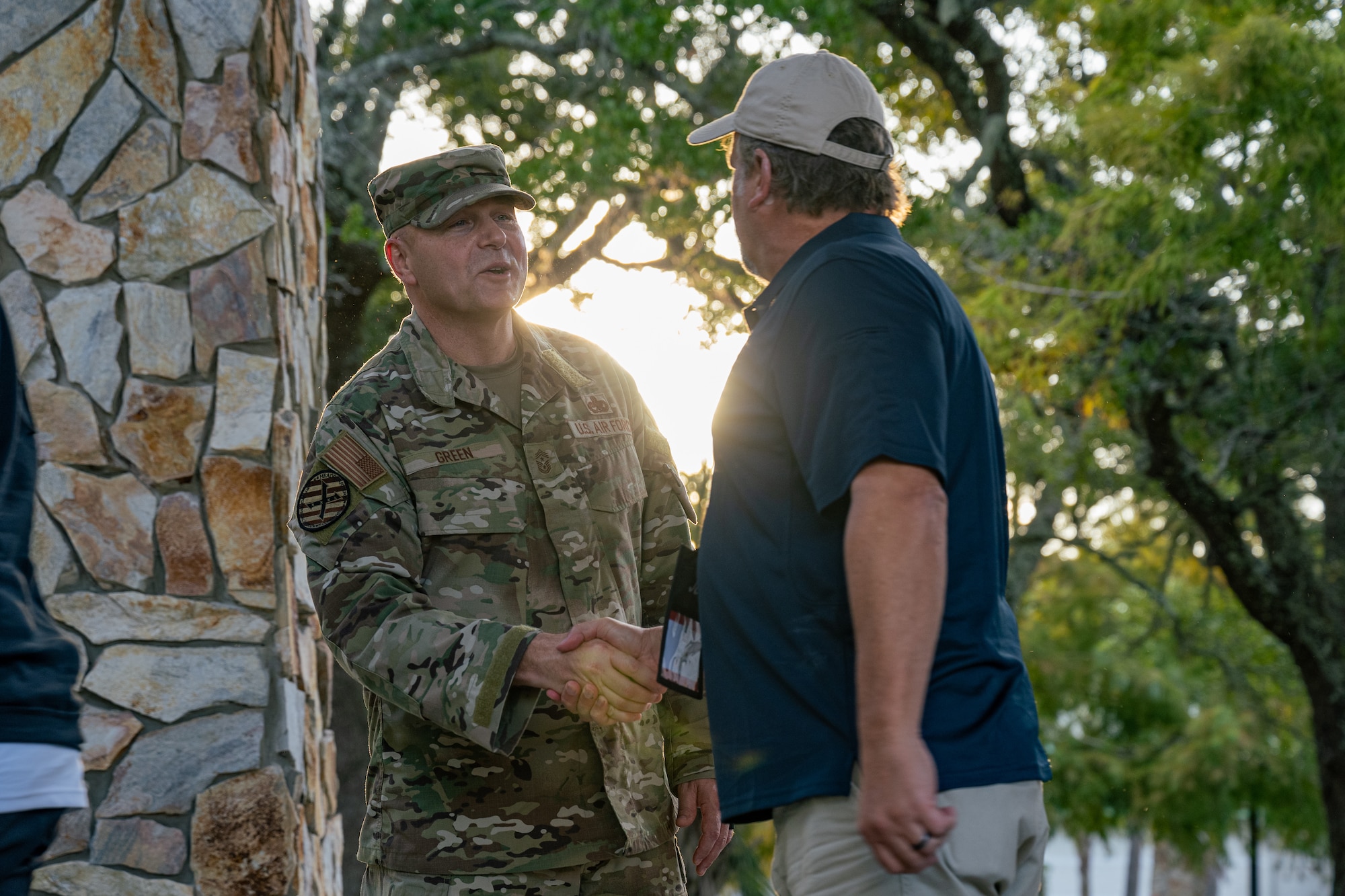 U.S. Air Force Chief Master Sgt. Anthony Green, Air Force Special Operations Command command chief, greets a civic leader during the 94th Joint Civilian Orientation Conference at Hurlburt Field, Florida, Sept. 20, 2023.