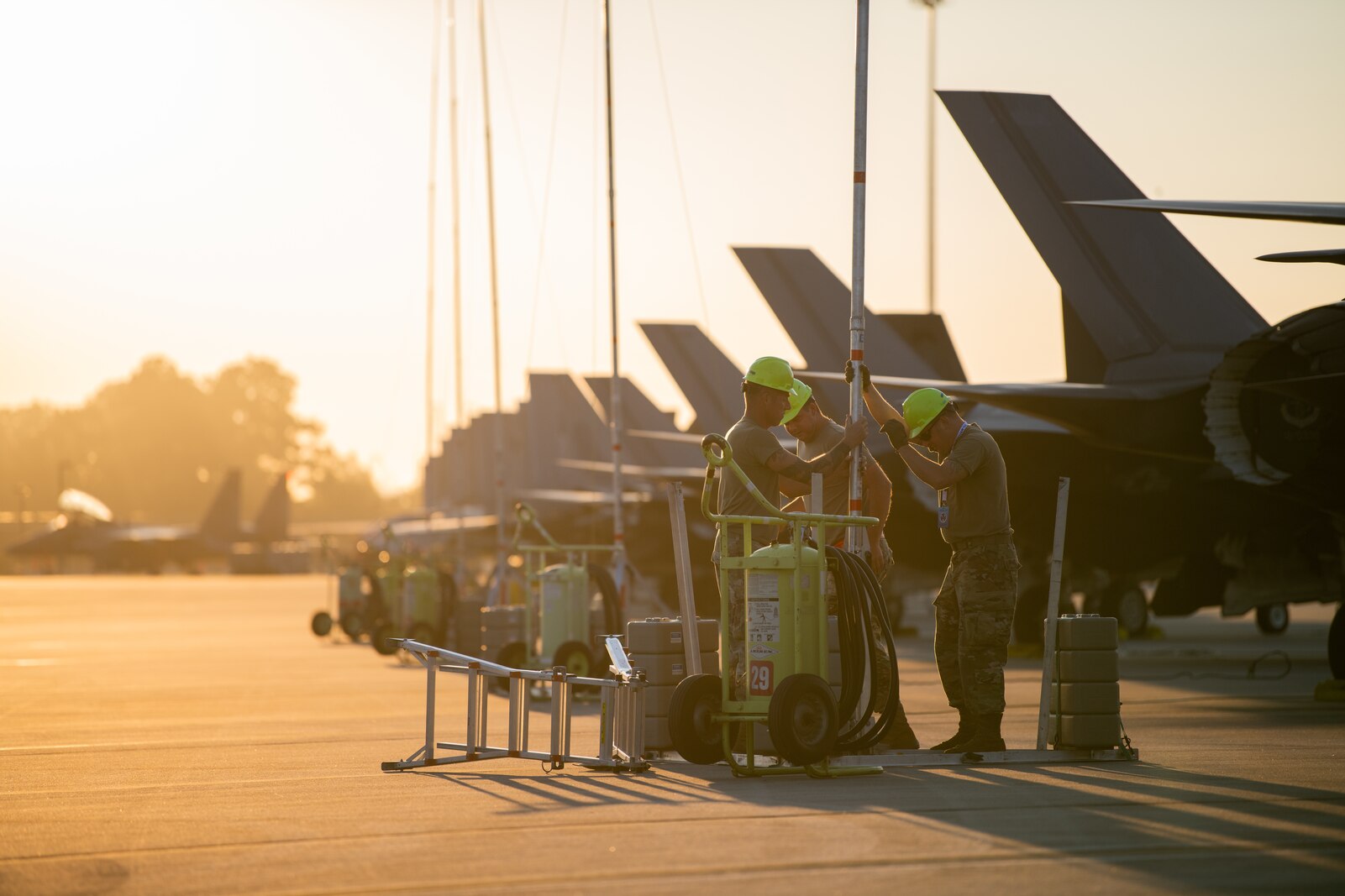 Photo of Airmen from the 158th Fighter Wing prepare for the third day of the William Tell competition at the Savannah Air National Guard Base, Georgia, Sept. 13, 2023. William Tell simulates real combat scenarios, challenging participants in air-to-air combat, aerial gunnery and air-to-ground targeting, including the combat and control aspects relating to participating aerial assets.