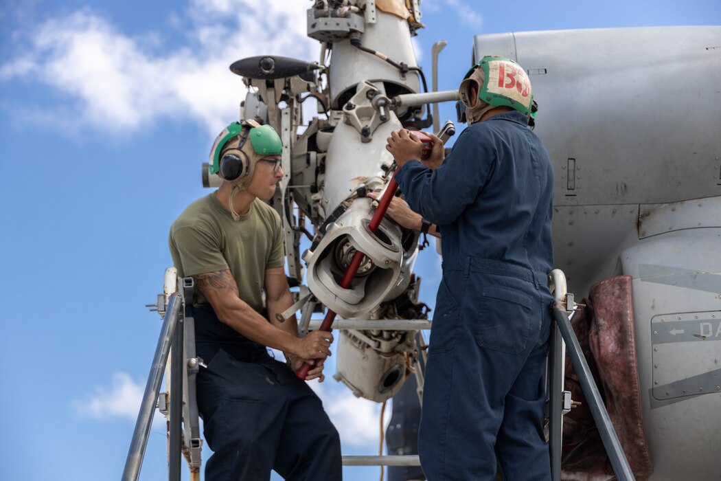 U.S. Marines with Marine Medium Tiltrotor Squadron 268, Marine Aircraft Group 24, conduct maintenance on a MV-22B Osprey, Marine Corps Air Station Kaneohe Bay, Marine Corps Base Hawaii, Sept. 11, 2023. Aviation Maintenance Marines conduct routine preventative maintenance on MV-22B Ospreys to ensure a constant state of readiness. (U.S. Marine Corps photo by Lance Cpl. Clayton Baker)