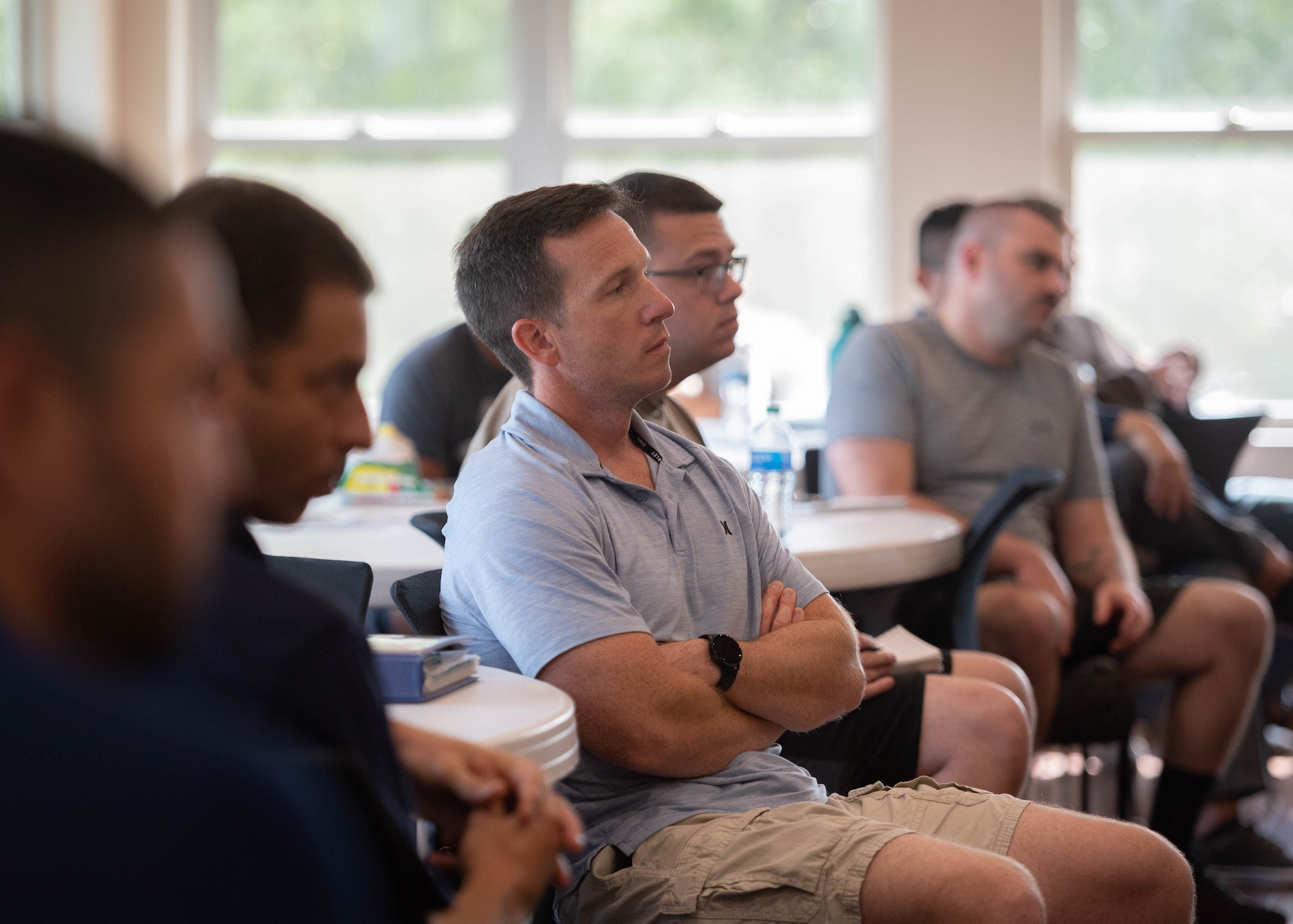 Man listening to speaker during presentation