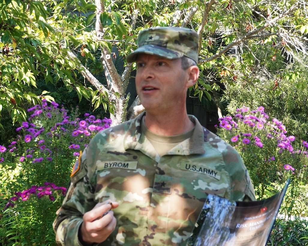 Photo of an Army officer in the rose garden of the Lake Washington Ship Canal and Hiram M. Chittenden Locks, Seattle, Washington.