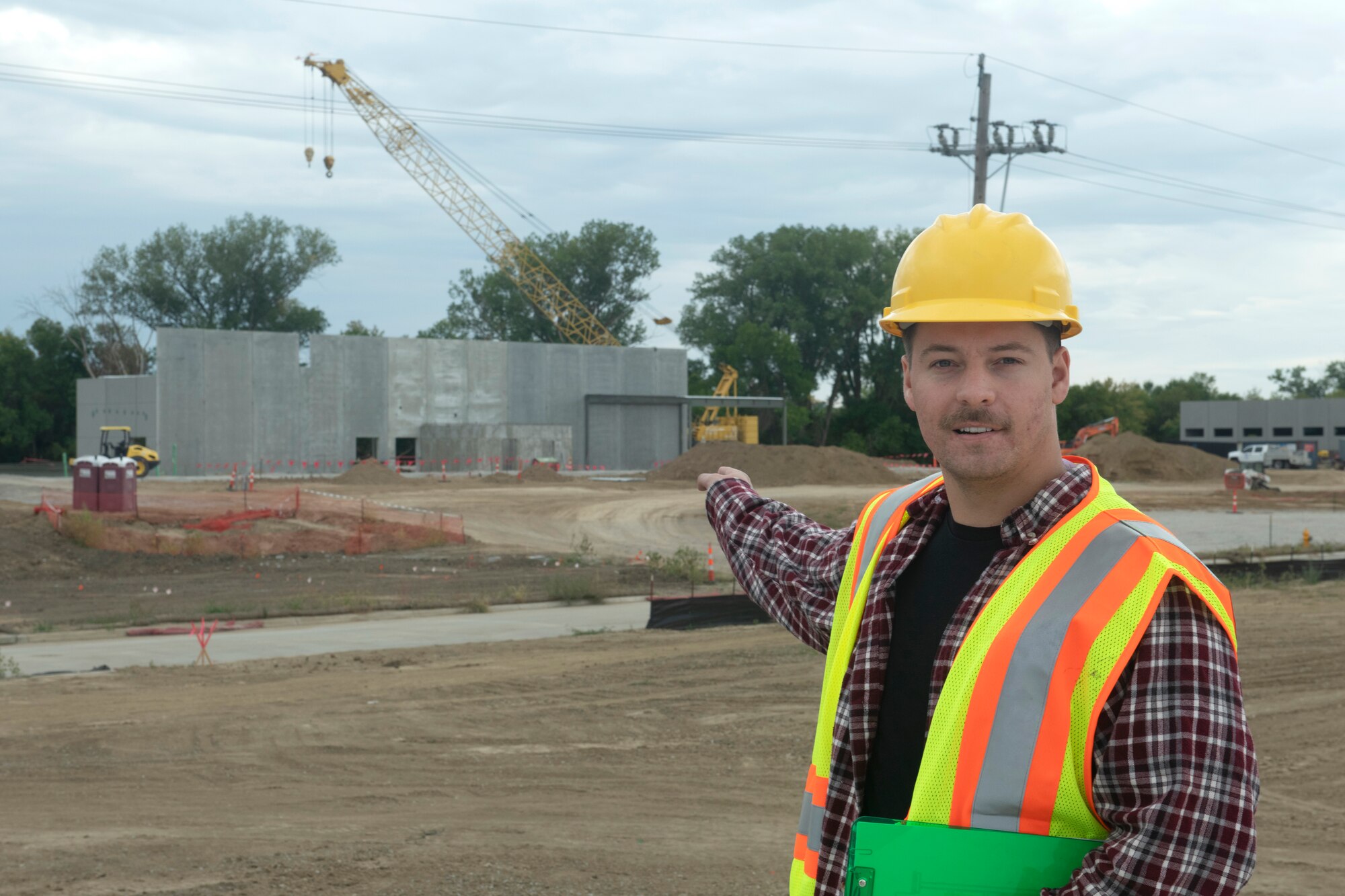 Ben Hudson, 55th Civil Engineer Squadron flood recovery office construction inspector, surveys the progress of the new security forces headquarters building Sept. 15, 2023, at Offutt Air Force Base, Nebraska.